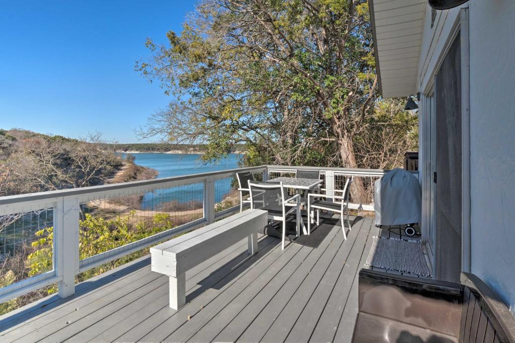 a wooden deck with a table and chairs on it at Pet-Friendly Belton Lake Studio with Deck and Kayaks! in Belton