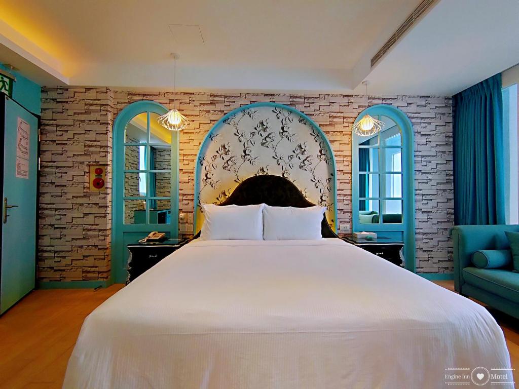 Postel nebo postele na pokoji v ubytování 浪琴Motel文創旅館