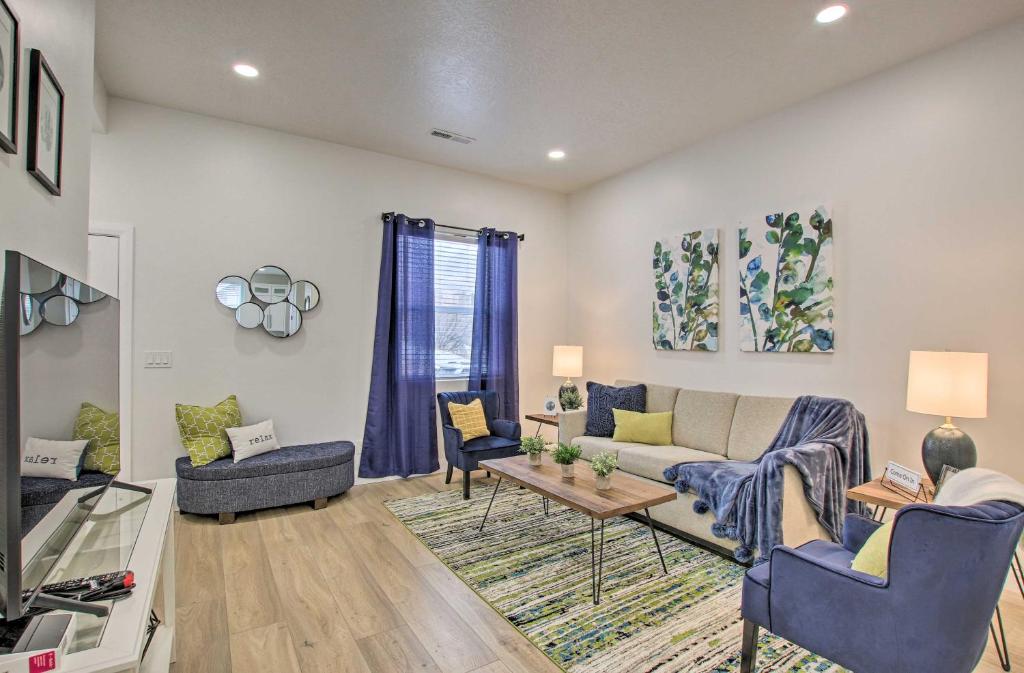 a living room with a couch and chairs and a table at Modern Mountain Escape Near Slopes, Lakes and Trails in Eden