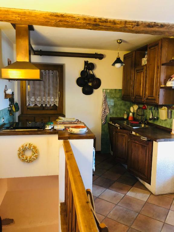 Kuchyň nebo kuchyňský kout v ubytování iRIVAS Lodge