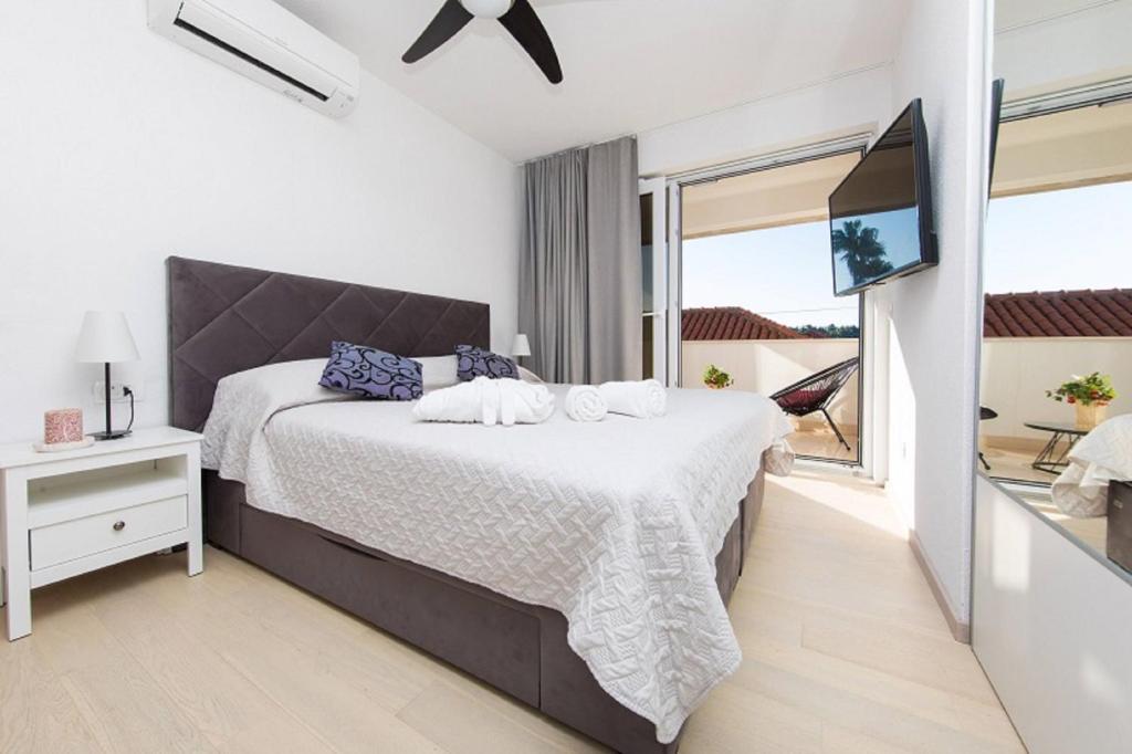 Postel nebo postele na pokoji v ubytování Apartments Kralj 2