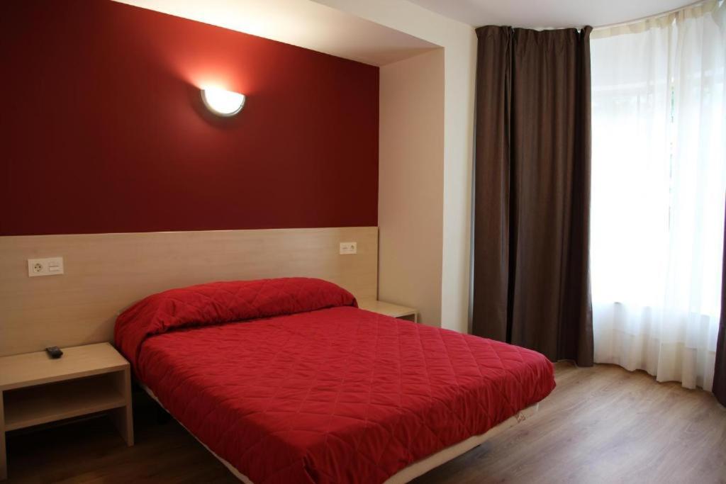 Posteľ alebo postele v izbe v ubytovaní Hostal Santel San Marcos