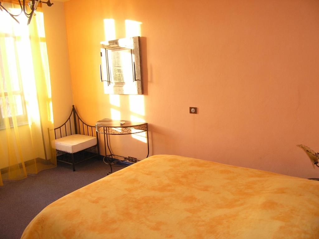 Postel nebo postele na pokoji v ubytování Auberge Magnette