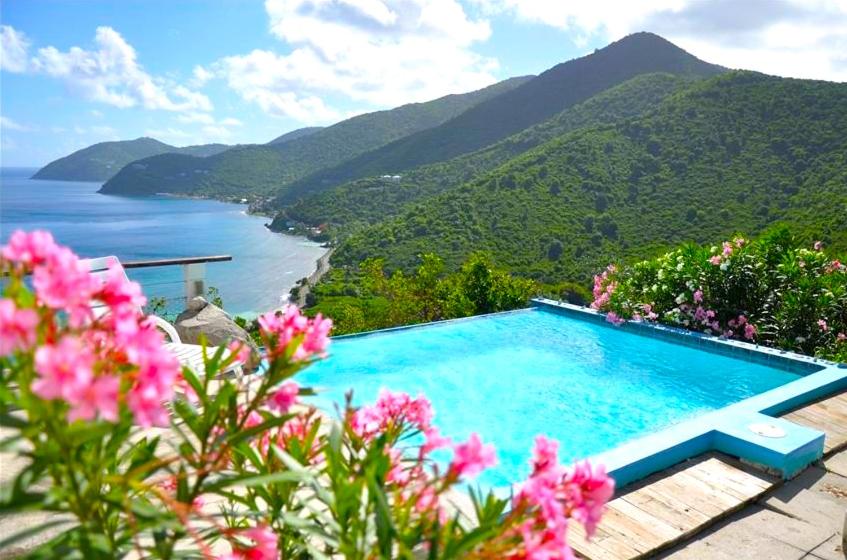 a swimming pool with a view of the ocean and mountains at Tortola Adventure Private Villa Ocean-View Pool in Freshwater Pond