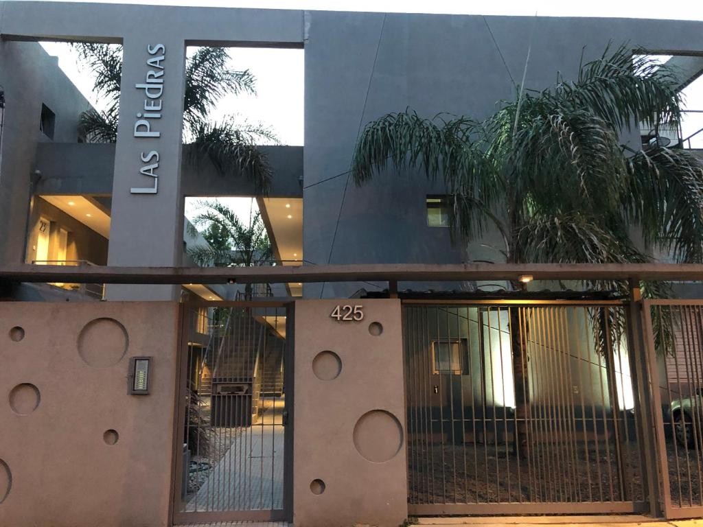 a building with a gate in front of it at Las Piedras in Pilar