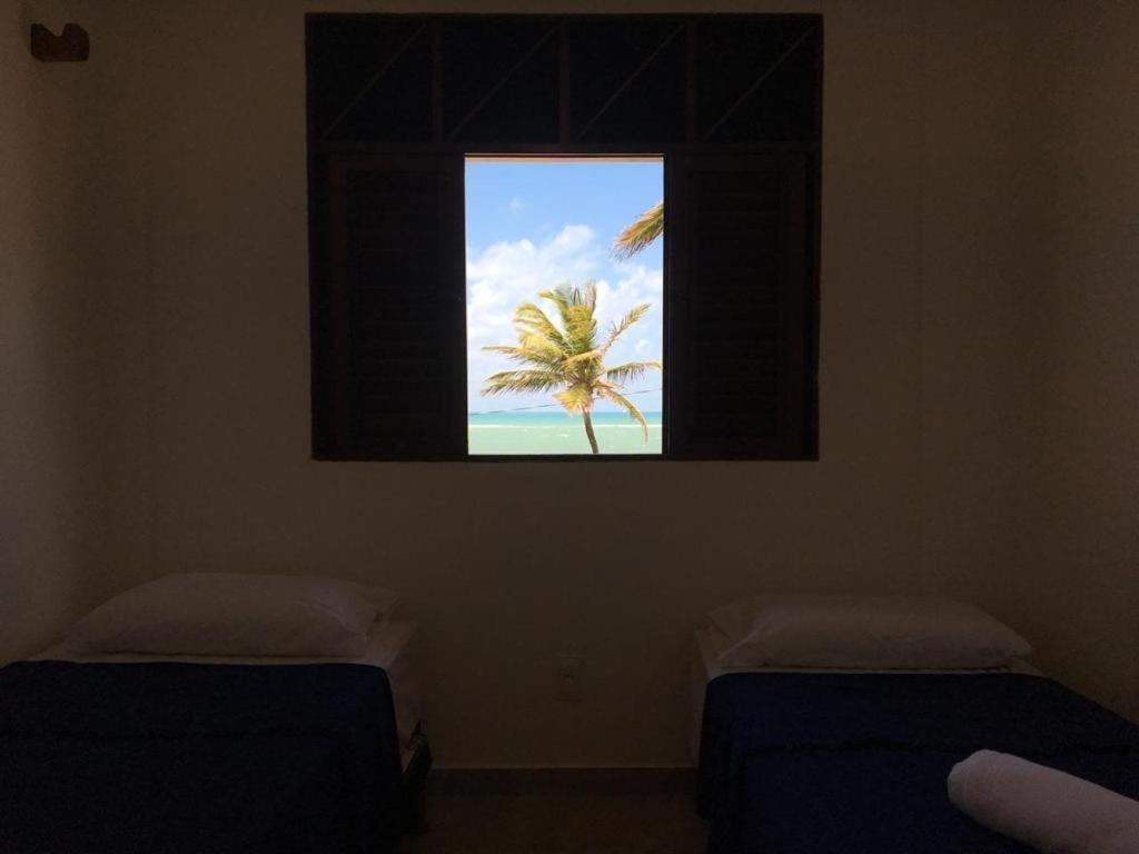 Cama ou camas em um quarto em Morada dos Cataventos (Frente Mar)