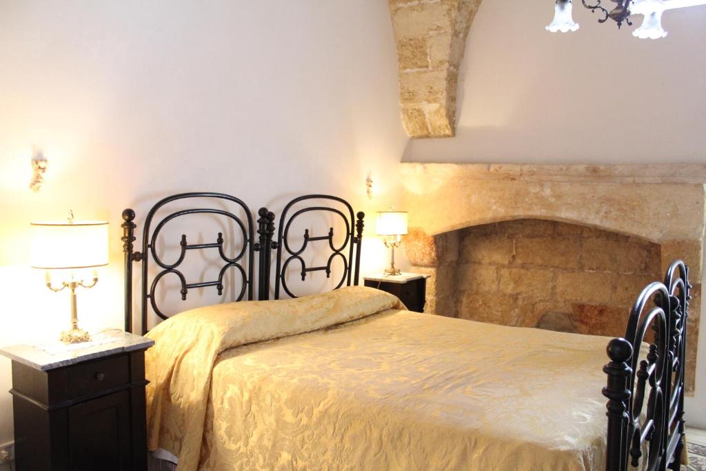 Säng eller sängar i ett rum på Palazzo Bitonti