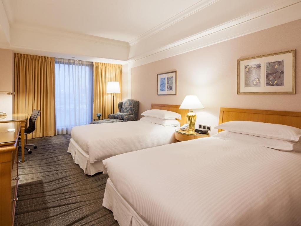 Кровать или кровати в номере RSL Hotel Taipei Zhonghe
