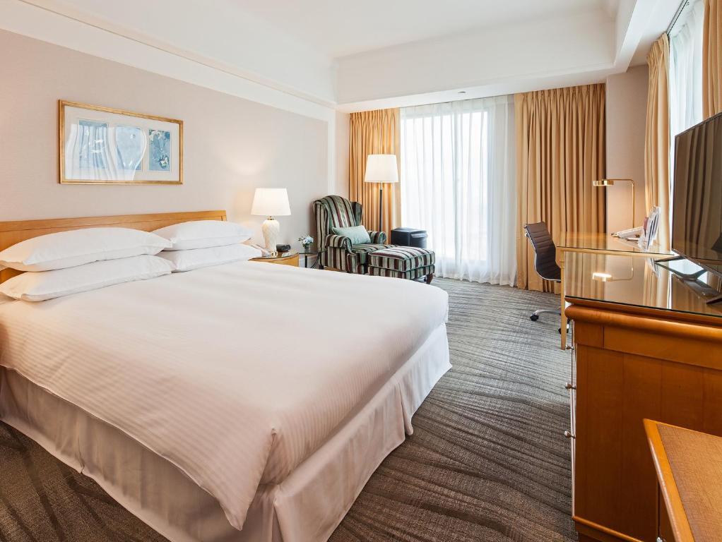 Postel nebo postele na pokoji v ubytování RSL Hotel Taipei Zhonghe