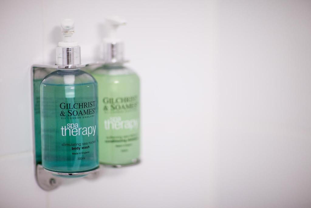 two bottles of cleaning products sitting next to each other at Leonardo Hotel Aberdeen in Aberdeen