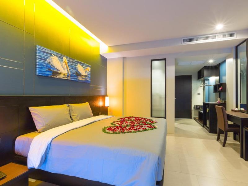 Postel nebo postele na pokoji v ubytování The Tama Hotel- SHA Plus