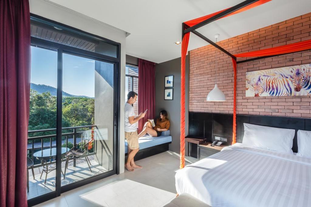 Postel nebo postele na pokoji v ubytování The Tama Hotel- SHA Plus