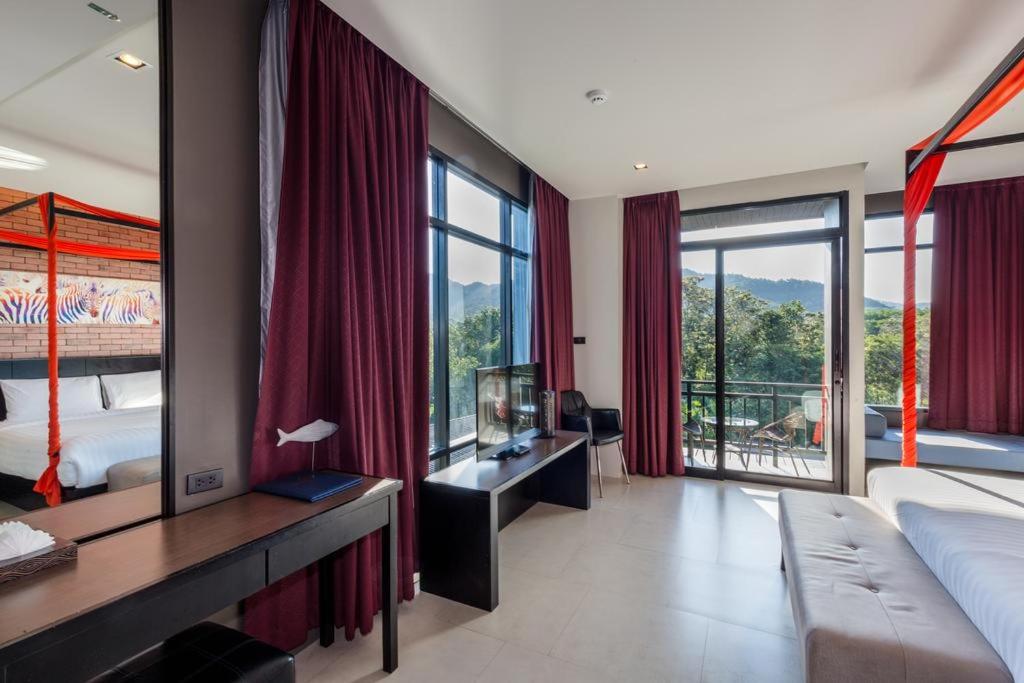 Postel nebo postele na pokoji v ubytování The Tama Hotel- SHA Plus