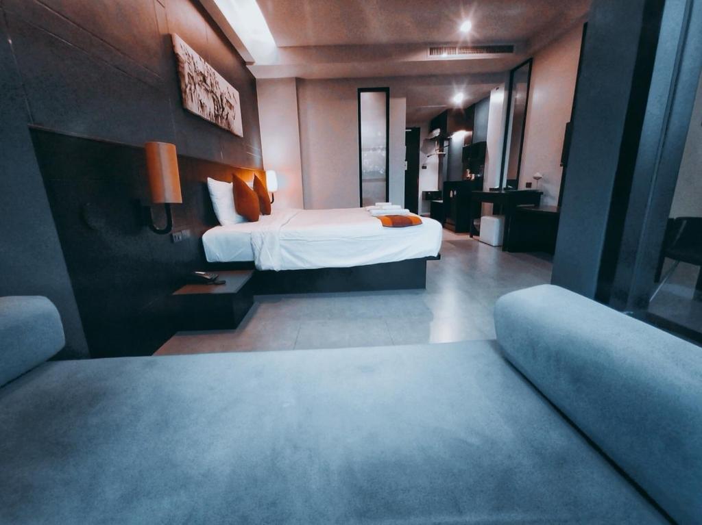 Postel nebo postele na pokoji v ubytování The Tama Hotel- SHA Plus