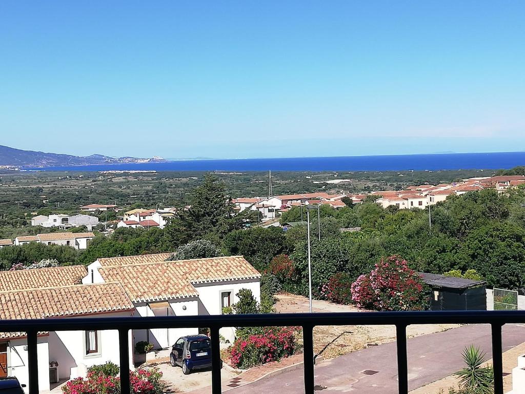 a view from a balcony of a town with the ocean at Appartamento La Vigna 3 in Badesi