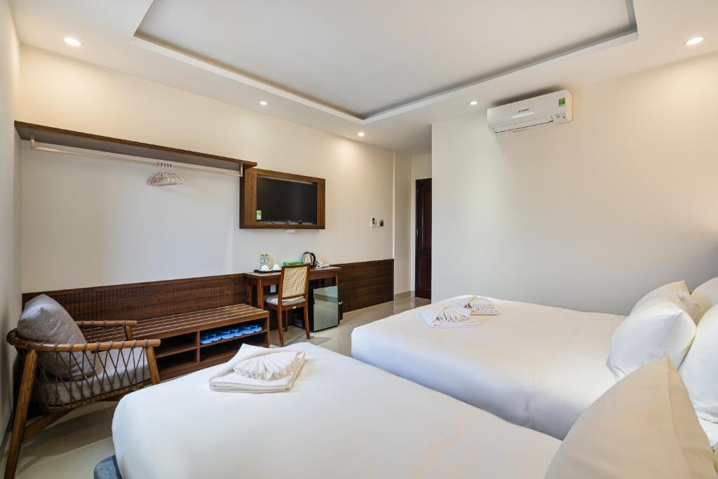 Postel nebo postele na pokoji v ubytování Aquatel Vung Tau