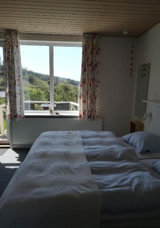 Postel nebo postele na pokoji v ubytování Munchs Badehotel