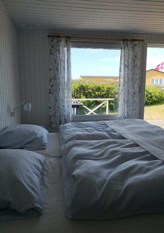 Postel nebo postele na pokoji v ubytování Munchs Badehotel