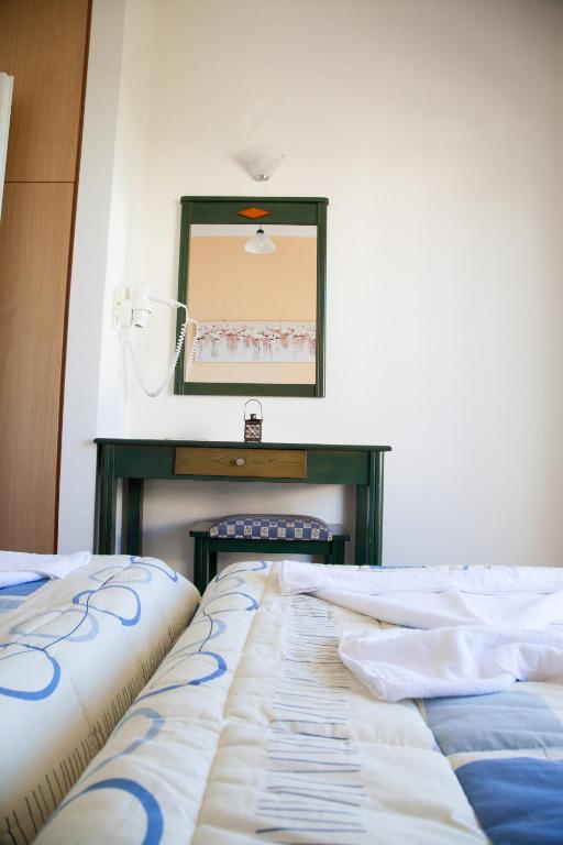 Postel nebo postele na pokoji v ubytování Meandros