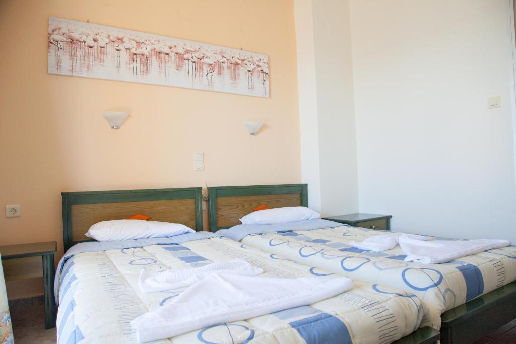 Postel nebo postele na pokoji v ubytování Meandros