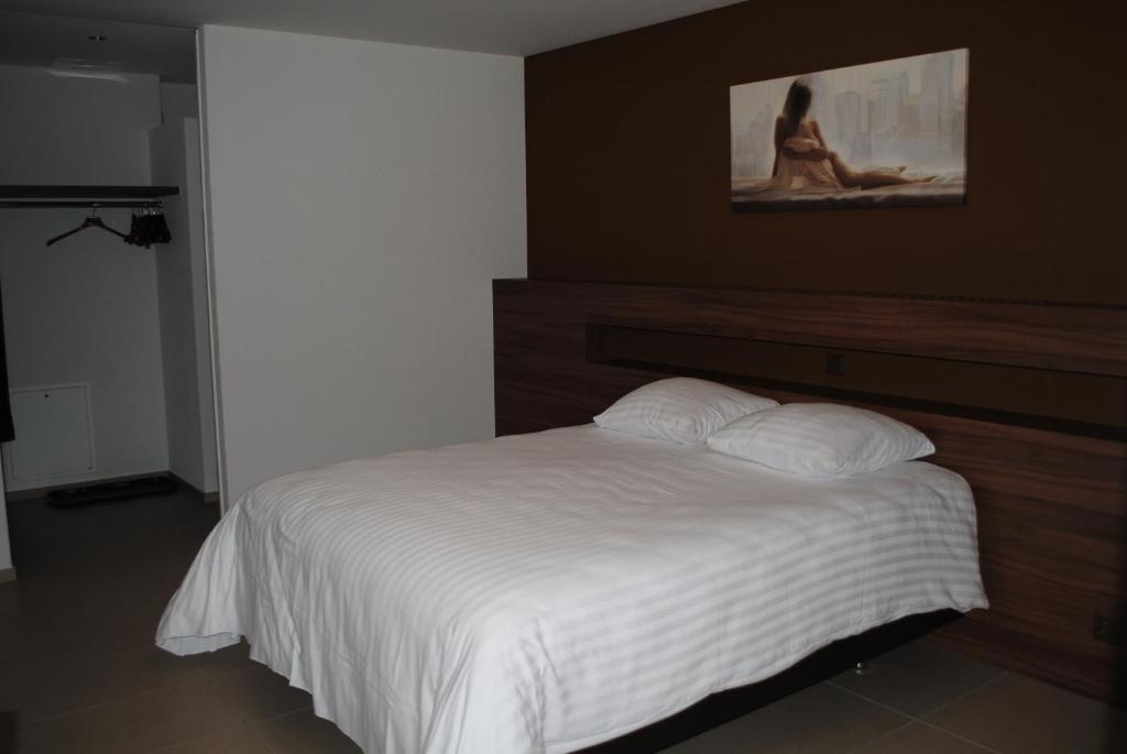 Postel nebo postele na pokoji v ubytování Hotel Du Soleil