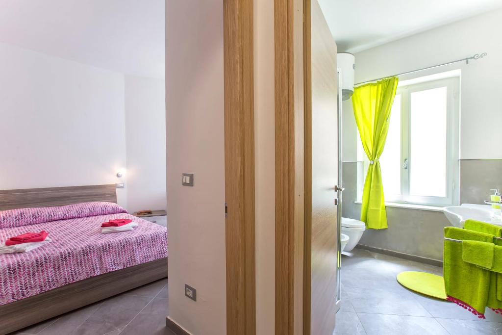Postel nebo postele na pokoji v ubytování Nonna Adelina Apartments & rooms