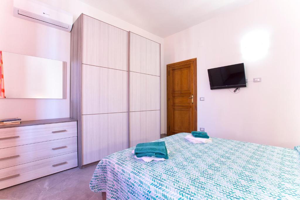 Postel nebo postele na pokoji v ubytování Nonna Adelina Apartments & rooms