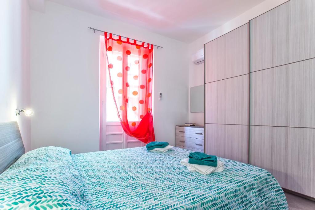 Postel nebo postele na pokoji v ubytování Nonna Adelina Apartments & rooms