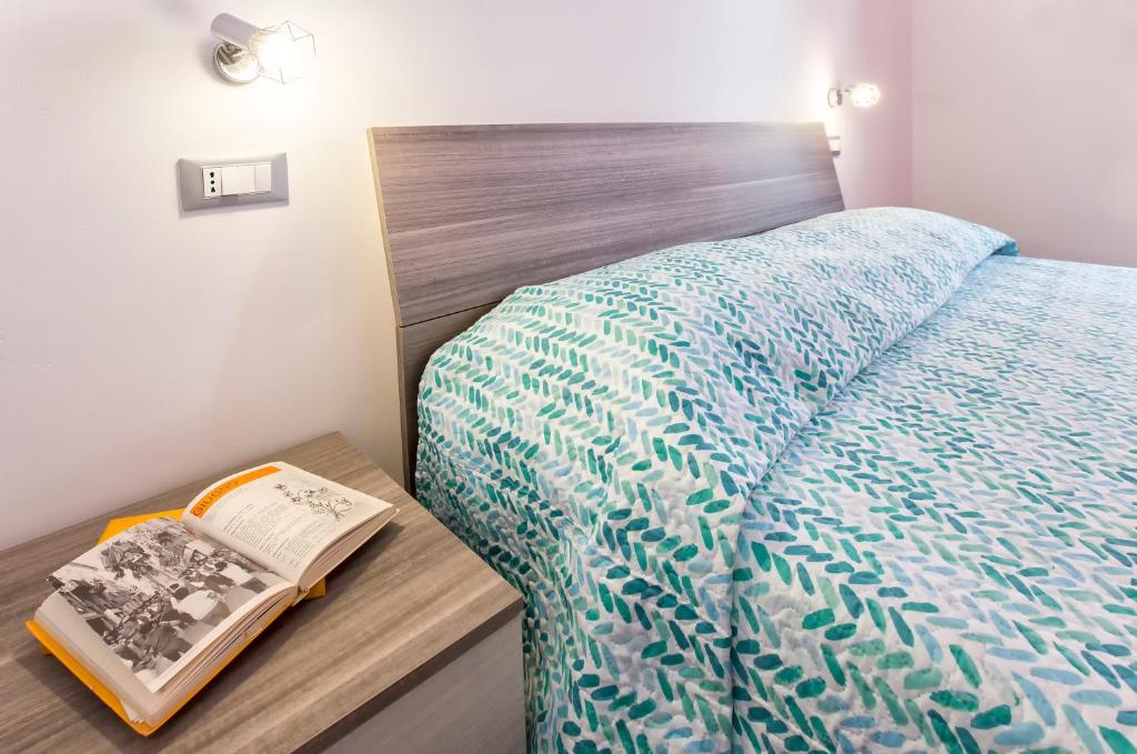 Postel nebo postele na pokoji v ubytování Nonna Adelina Apartments & rooms