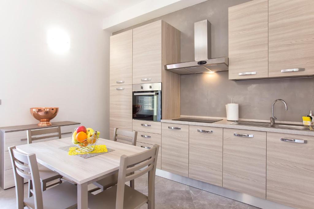 Kuchyň nebo kuchyňský kout v ubytování Nonna Adelina Apartments & rooms