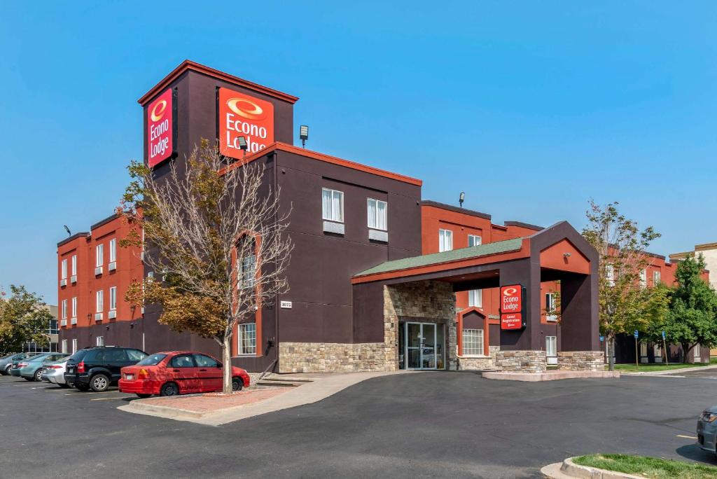 a dunkin donuts building in a parking lot at Econo Lodge North Academy in Colorado Springs
