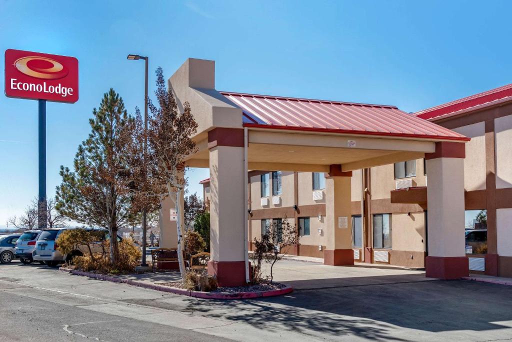 a building at a hotel with a gas station at Econo Lodge in Pueblo