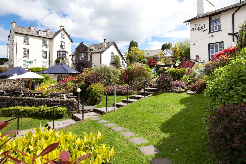 a garden in front of a house at The Angel Inn - The Inn Collection Group in Bowness-on-Windermere