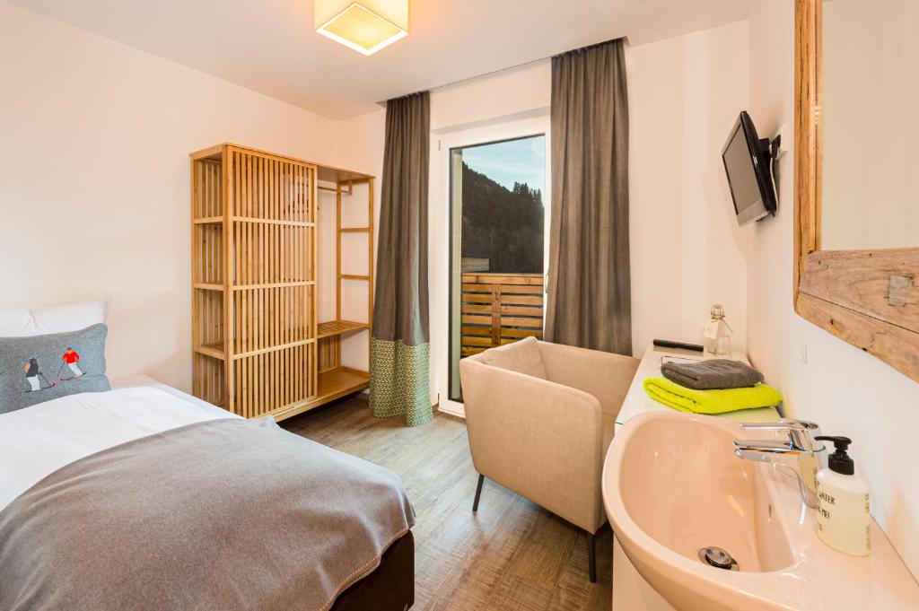 Postel nebo postele na pokoji v ubytování Lifesport Hotel Hechenmoos