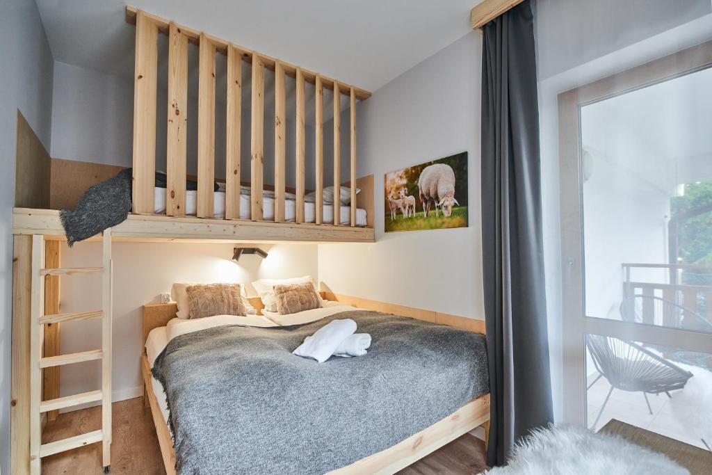 Posteľ alebo postele v izbe v ubytovaní VIP Apartamenty, ORKANA APART
