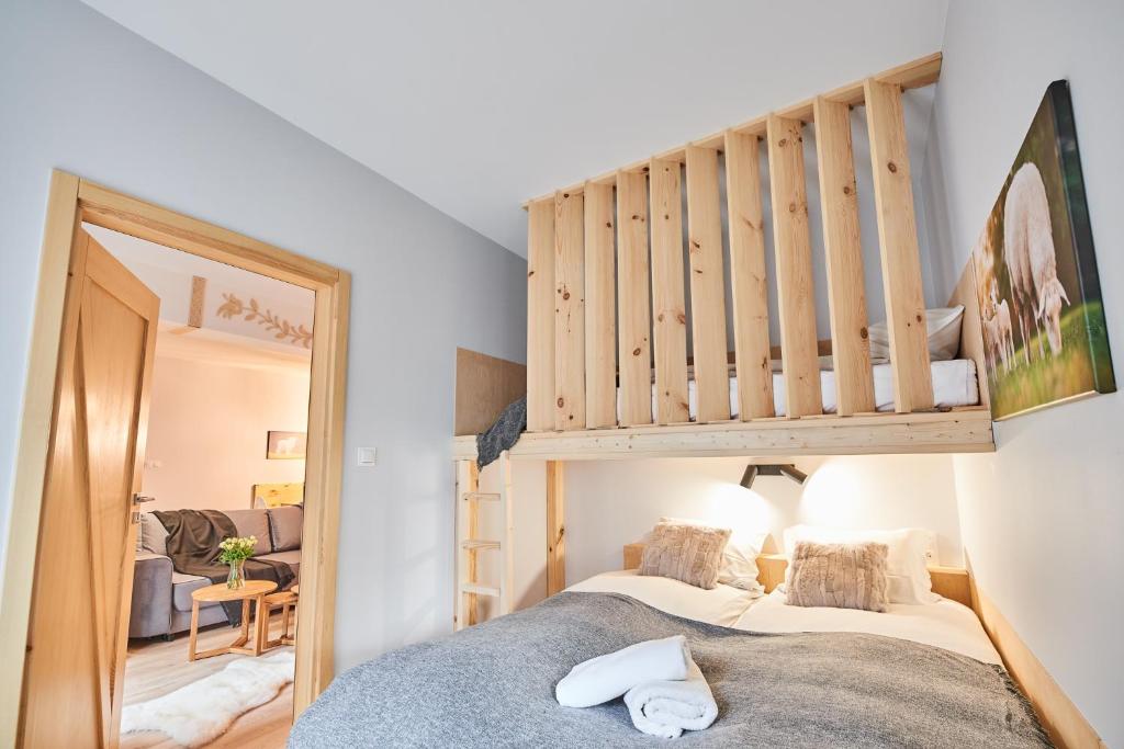 Posteľ alebo postele v izbe v ubytovaní VIP Apartamenty, ORKANA APART