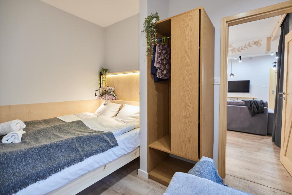 Posteľ alebo postele v izbe v ubytovaní VIP Apartamenty, ORKANA APART
