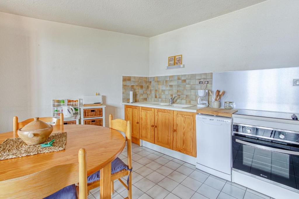 Kuchyň nebo kuchyňský kout v ubytování Les Fauvettes - appartement vue imprenable sur montagne