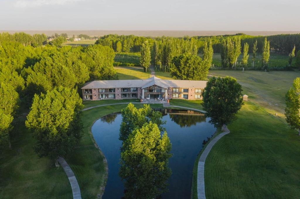 an aerial view of a house with a pond at Casa Septem in Villa Seca