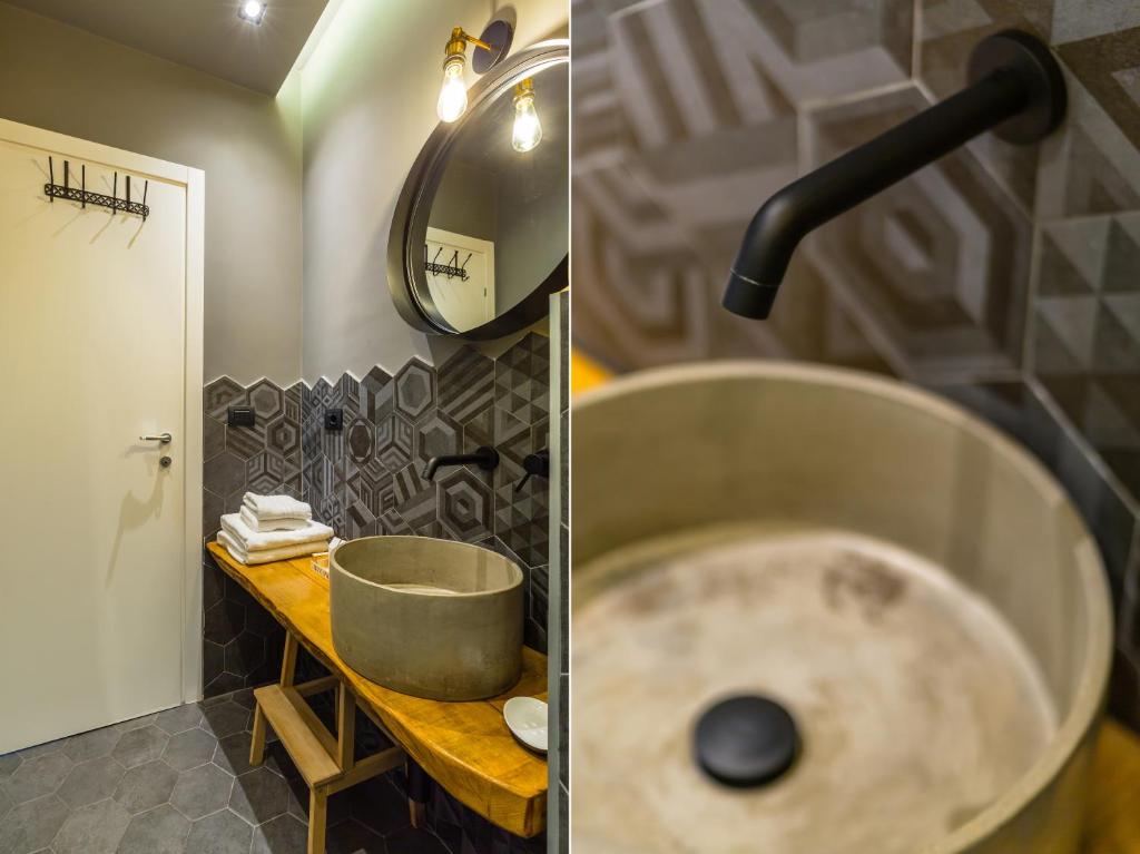 A bathroom at Starhost - MINERVA SUITE seaview