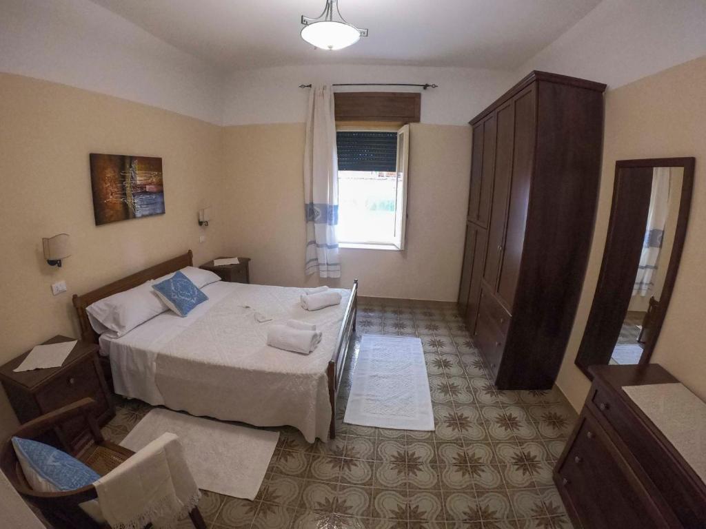 Łóżko lub łóżka w pokoju w obiekcie Casa A&M