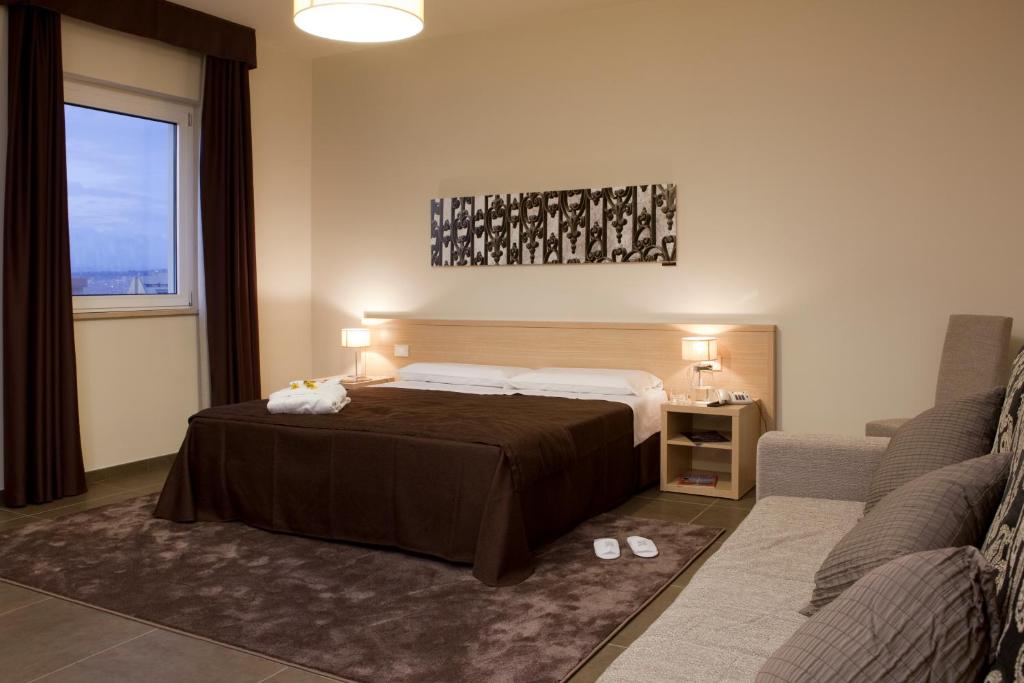 Voodi või voodid majutusasutuse Hotel Torre Del Sud toas