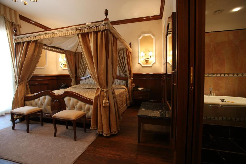 Voodi või voodid majutusasutuse Hotel Borgo Don Chisciotte toas