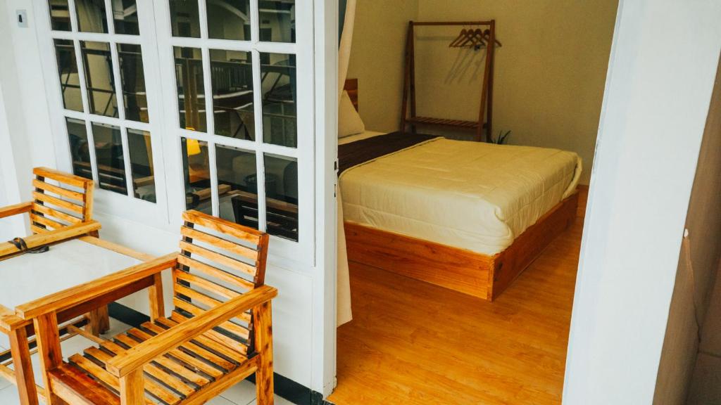 Postel nebo postele na pokoji v ubytování Hotel Gunung Mas Syariah