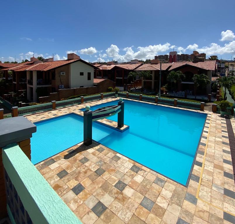 The swimming pool at or close to Linda casa Porto das Dunas: 4 suítes, churrasqueira e piscina