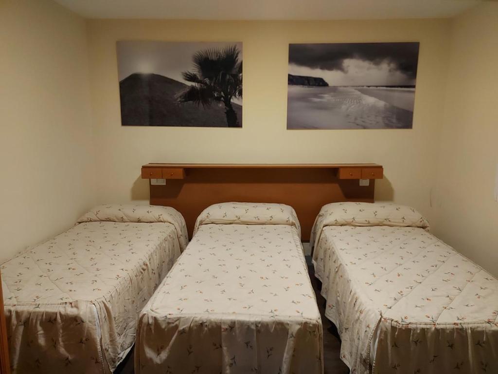Postel nebo postele na pokoji v ubytování Hostal Moncloa