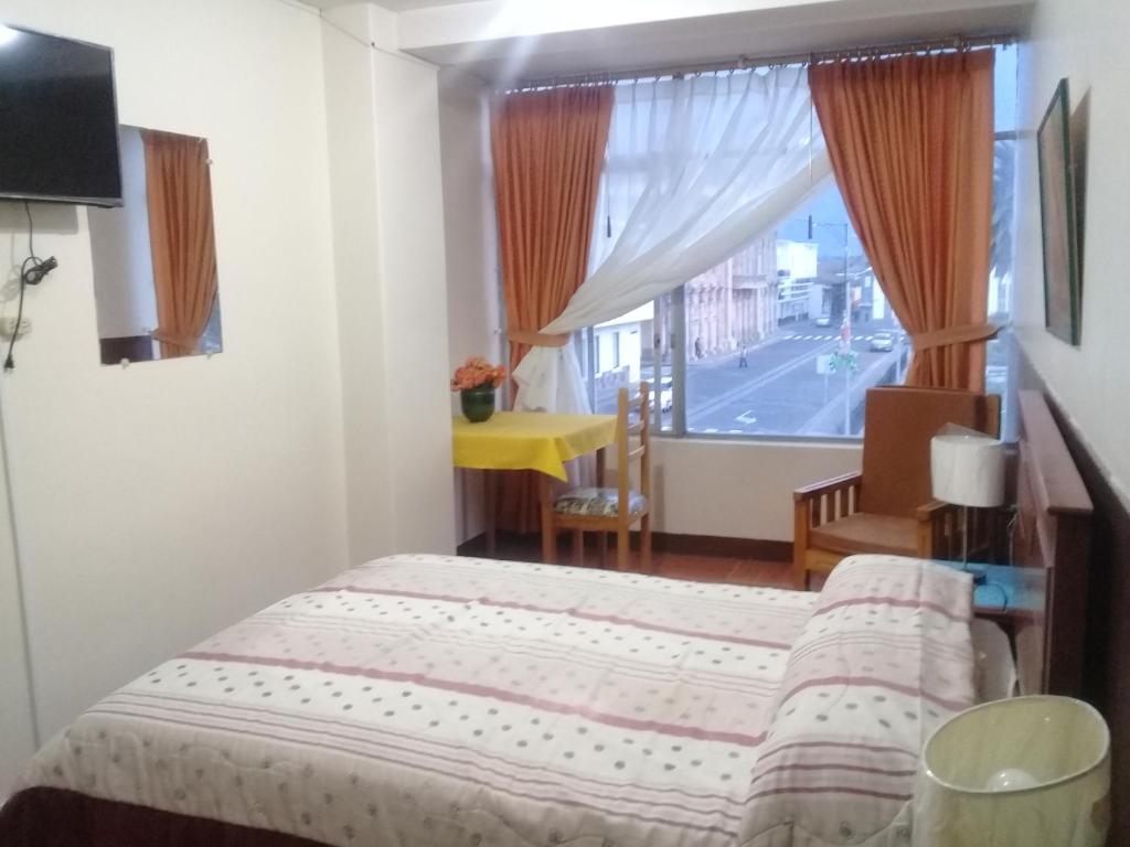 Postel nebo postele na pokoji v ubytování Hotel Central