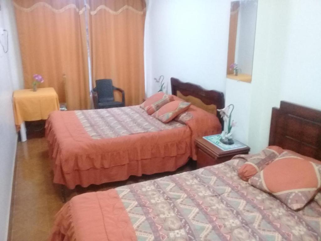Postel nebo postele na pokoji v ubytování Hotel Central