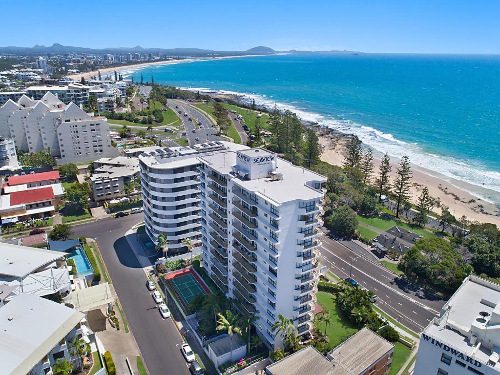 an aerial view of a building and the beach at Seaview Resort in Mooloolaba