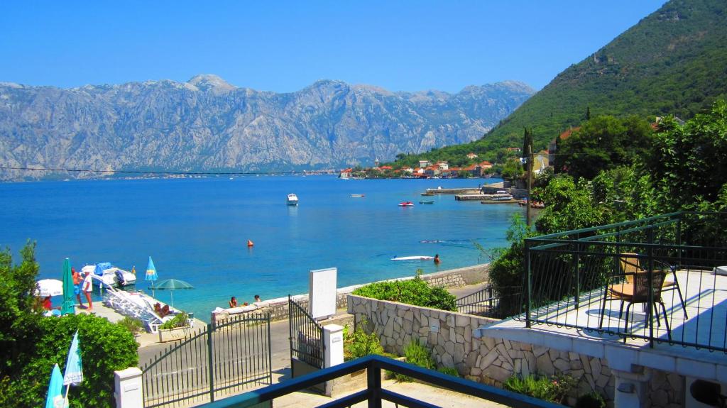 a view of a body of water with mountains at Apartments Iva in Kotor
